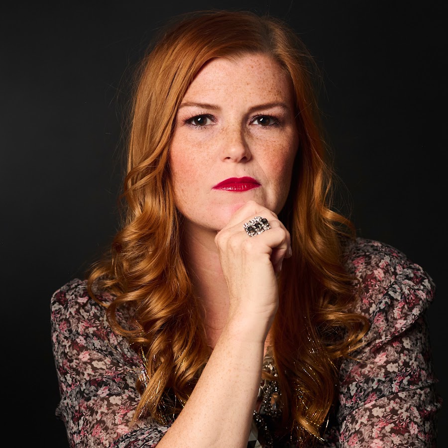 Jackie Nash, photographed against a dark background.